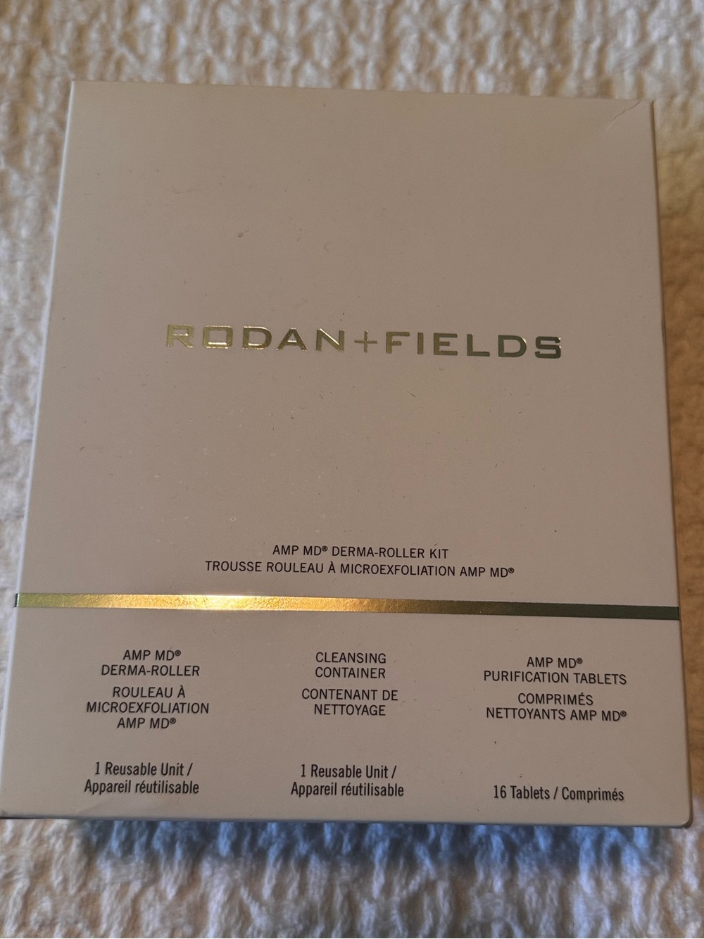 Rodan + Fields white and silver derma-roller skincare kit